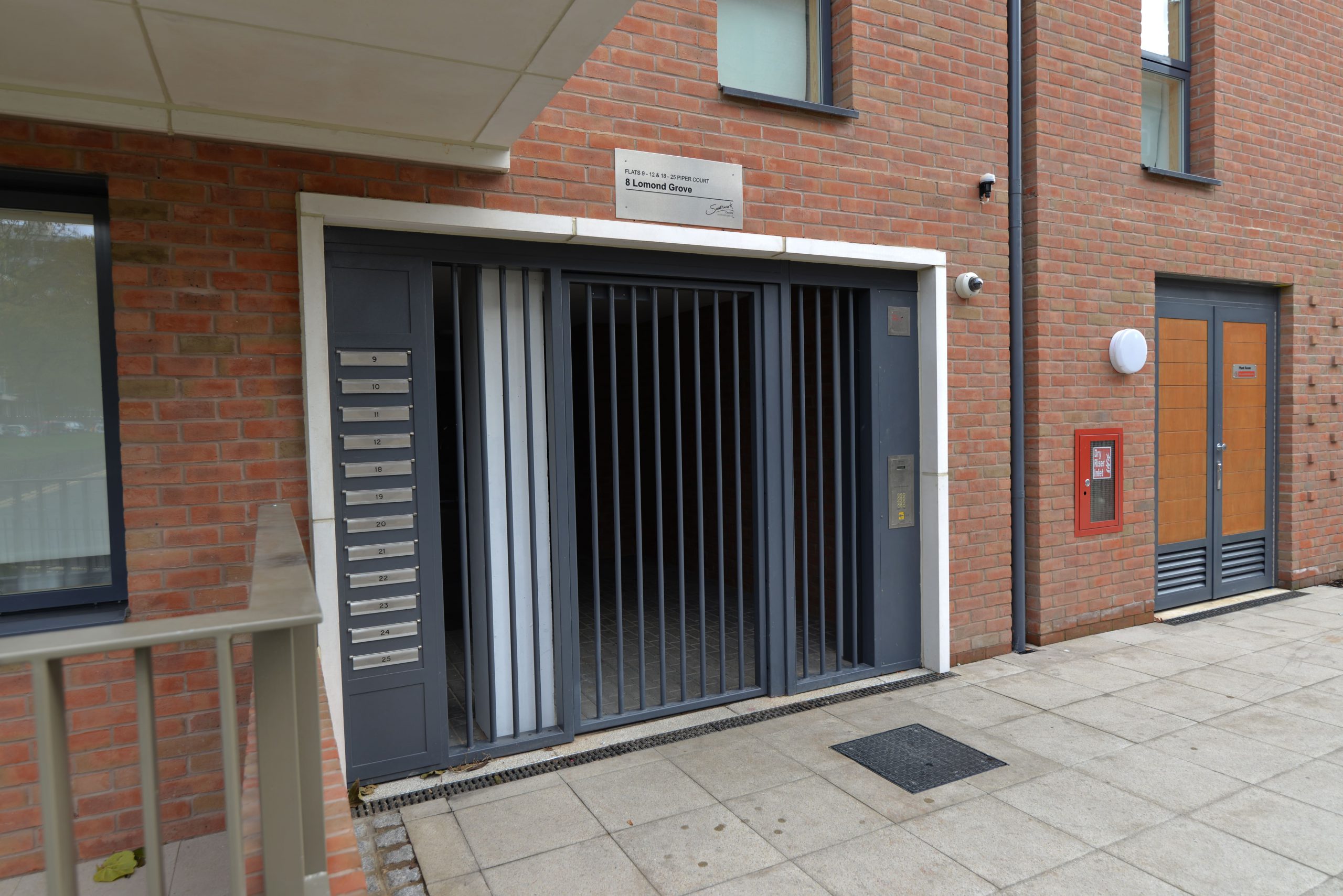 INDUSTRIAL STEEL GATES AND INTEGRATED MAIL BOX SYSTEM FABRICATED TO LPS1175 SR2 AND PAS24 STANDARD. PRODUCED AND INSTALLED BY PREMIER SECURITY CONSULTANTS LTD.