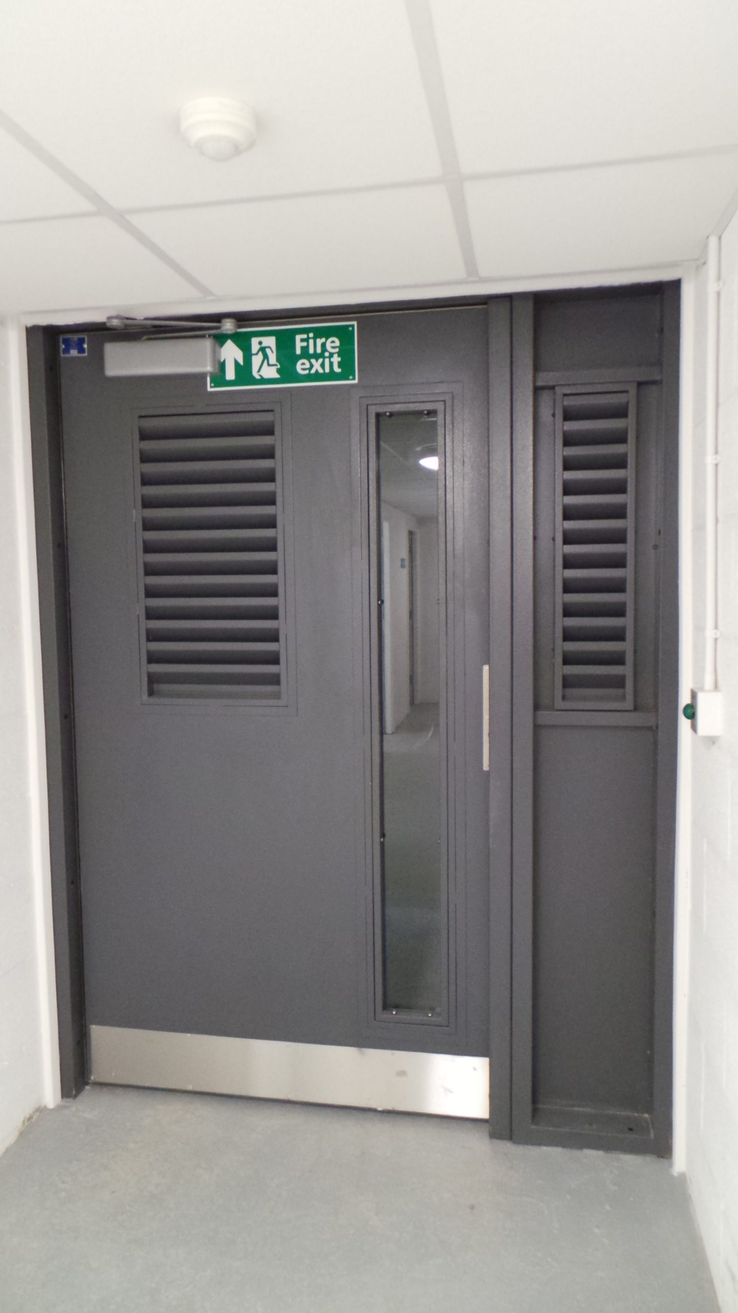 INDUSTRIAL STEEL DOORS WITH LOUVRE SECTIONS FABRICATED TO LPS1175 SR2 AND PAS24 STANDARD. PRODUCED AND INSTALLED BY PREMIER SECURITY CONSULTANTS LTD.