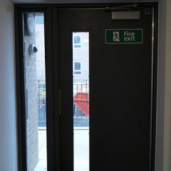 FIRE EXIT STEEL DOOR FABRICATED AND INSTALLED BY PREMIER SECURITY CONSULTANTS OF ILFORD